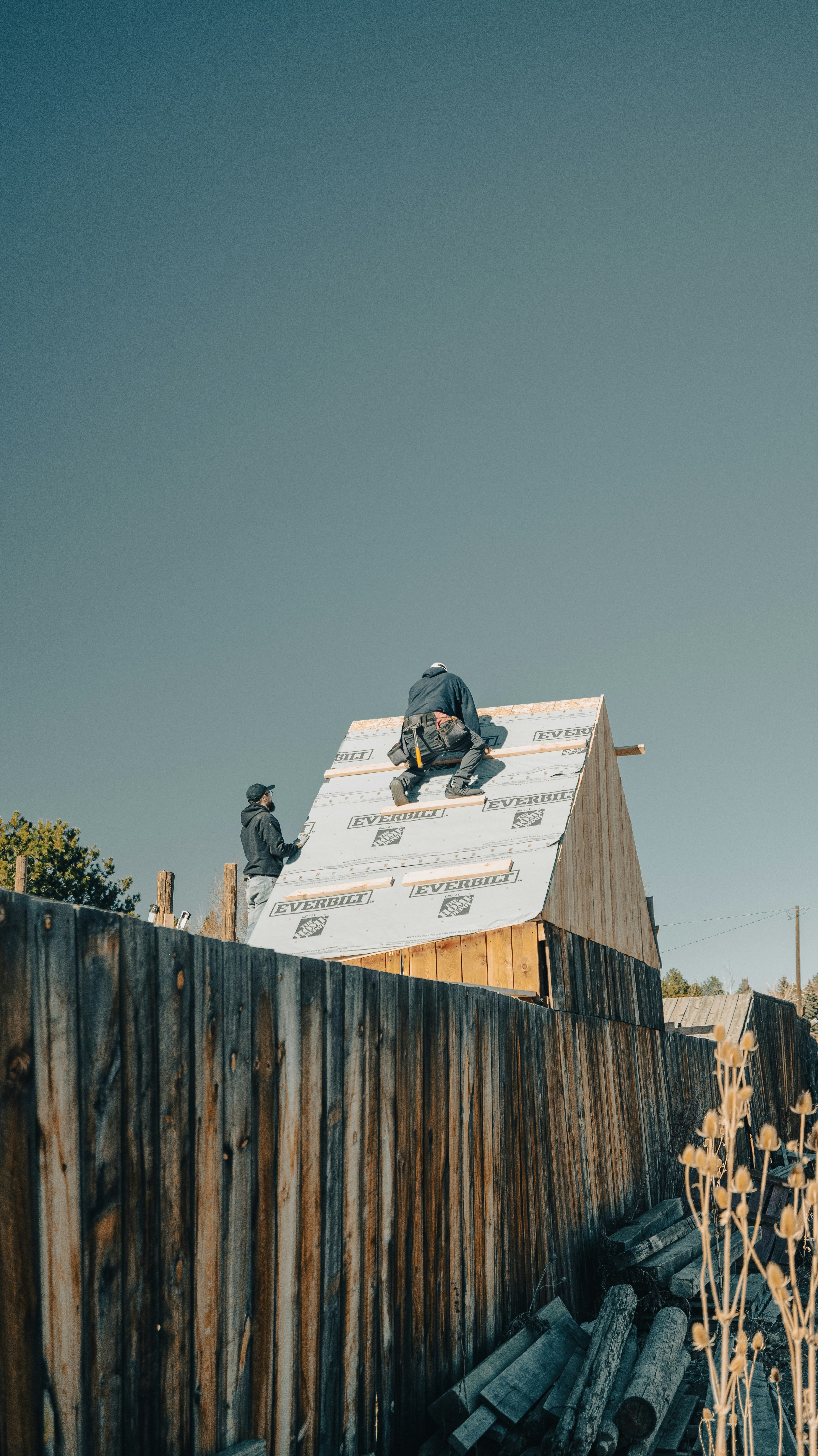 Licensed roofer working on a residential roof in Salt Lake County, Utah